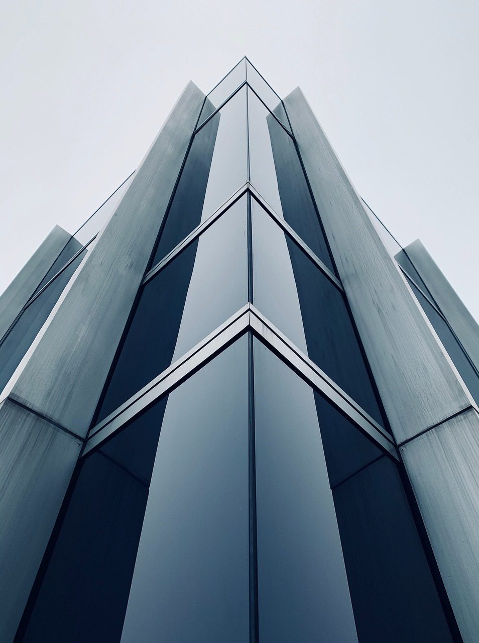 an angular looking building/skyscraper, with lots of dark looking windows giving the building an evil look, appropriate for a government heh